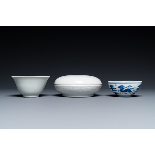 748 - A Chinese white-glazed bowl, a small blue and white bowl and a covered box with incised design, Ming... 