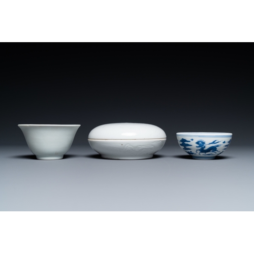 748 - A Chinese white-glazed bowl, a small blue and white bowl and a covered box with incised design, Ming... 