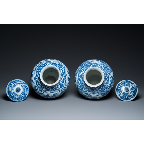 750 - A pair of Chinese blue and white vases and covers with figurative design, MingH.: 41,5 cm (the talle... 