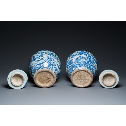 750 - A pair of Chinese blue and white vases and covers with figurative design, MingH.: 41,5 cm (the talle... 