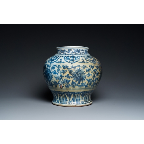 751 - A Chinese blue and white 'guan' jar with lotus scrolls, MingH.: 30 cm