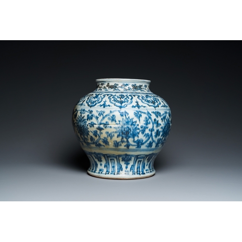 751 - A Chinese blue and white 'guan' jar with lotus scrolls, MingH.: 30 cm