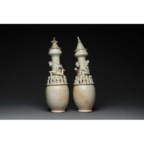 768 - Two large Chinese qingbai-glazed covered urns with applied design, Song/YuanH.: 56 cm (the tallest)... 