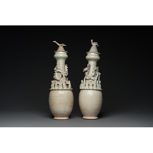 768 - Two large Chinese qingbai-glazed covered urns with applied design, Song/YuanH.: 56 cm (the tallest)... 