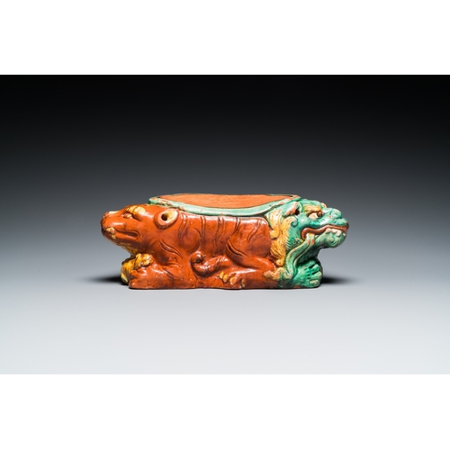 788 - A Chinese sancai-glazed 'three lions' pillow or neck rest, MingDim.: 37 x 15,5 x 14 cm
 
 Provenance... 