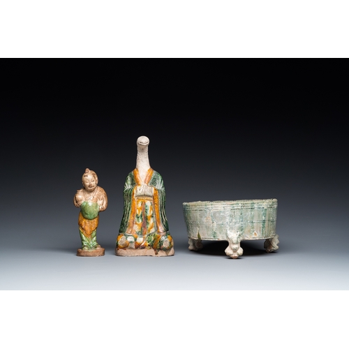 795 - Two Chinese sancai-glazed figures and a green-glazed tripod censer, Han and laterH.: 21 cm (the tall... 