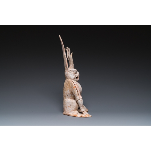 801 - A Chinese painted pottery earth spirit, TangH.: 45 cm
 
 Provenance:- The collection of Mr. and Mrs.... 