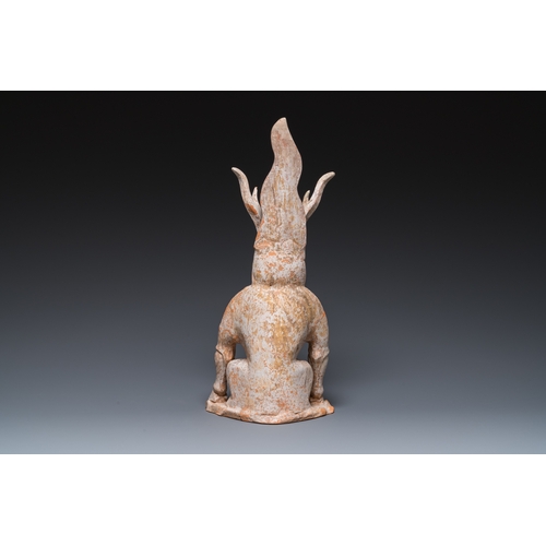 801 - A Chinese painted pottery earth spirit, TangH.: 45 cm
 
 Provenance:- The collection of Mr. and Mrs.... 