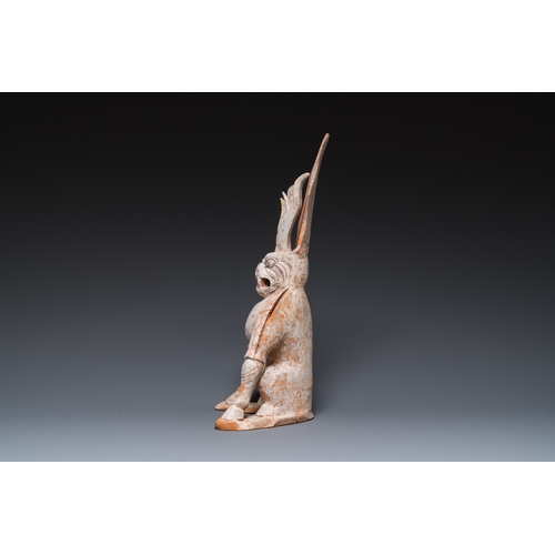 801 - A Chinese painted pottery earth spirit, TangH.: 45 cm
 
 Provenance:- The collection of Mr. and Mrs.... 