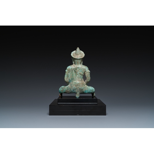 818 - A Thai bronze Buddha in Lopburi-style, probably 11th C.H.: 25 cm (incl. stand) H.: 20 cm (the figure... 