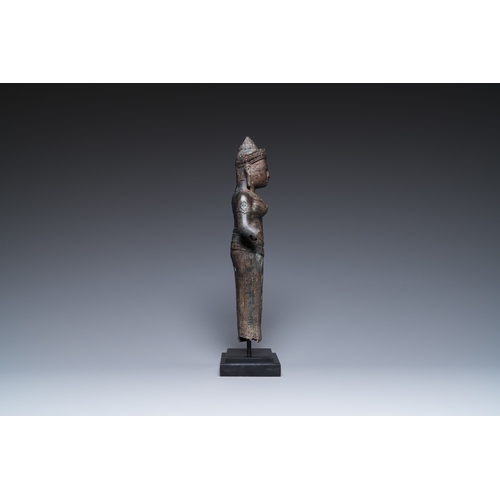 827 - A bronze Khmer sculpture of the goddess Uma, Cambodia, 10/11th C.H.: 42,5 cm (incl. stand) H.: 39 cm... 