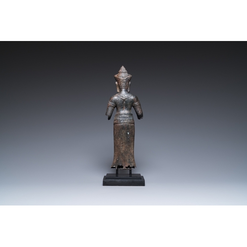 827 - A bronze Khmer sculpture of the goddess Uma, Cambodia, 10/11th C.H.: 42,5 cm (incl. stand) H.: 39 cm... 