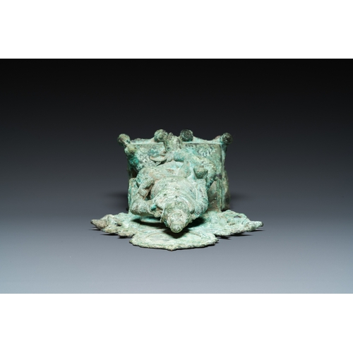 833 - A bronze group with Kubera on a throne, Central Java, Indonesia, 11/12th C.H.: 31 cm
 
 Provenance:-... 