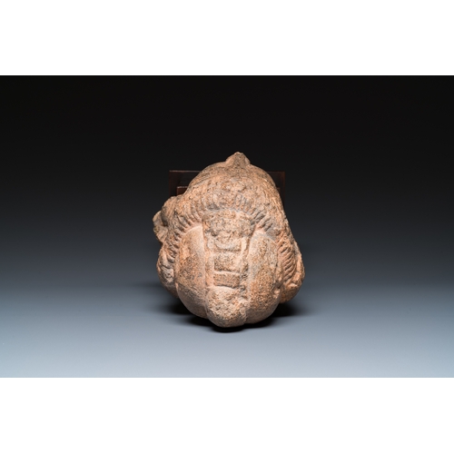 834 - A Javanese carved andesite stone head of Shiva, Indonesia, probably 8/9th C.H.: 35 cm (incl. stand) ... 