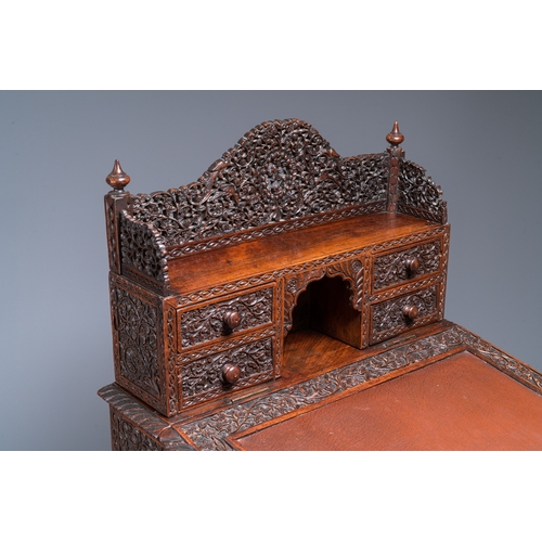 840 - A colonial Anglo-Indian reticulated wooden desk with hidden compartment, 19th C.H.: 123 cm - W.: 65 ... 