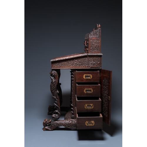 840 - A colonial Anglo-Indian reticulated wooden desk with hidden compartment, 19th C.H.: 123 cm - W.: 65 ... 