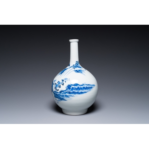 847 - A Japanese blue and white bottle vase with a lady in a landscape, Edo, 17/18th C.H.: 35 cm... 