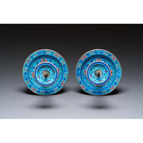 885 - A pair of Chinese light-blue-ground Canton enamel candlesticks, YongzhengH.: 34 cm