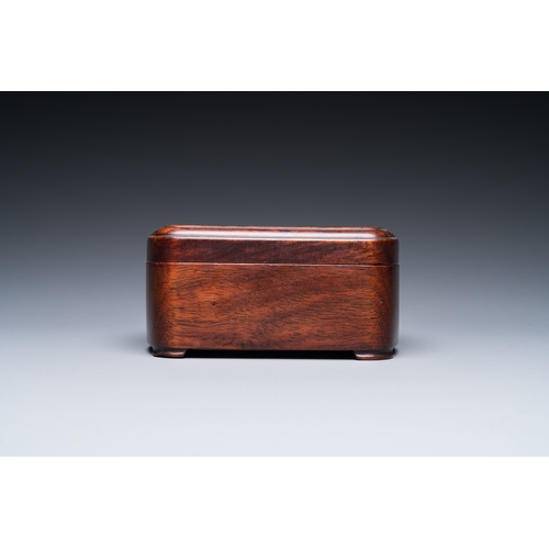 910 - A Chinese huali box and cover, a burl wood-topped stand, a table screen mirror and a pair of Buddhis... 