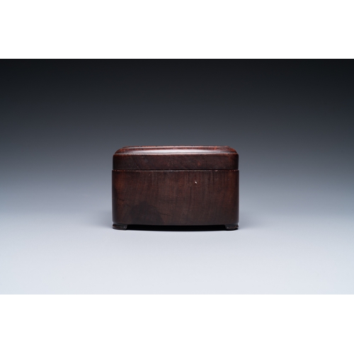 910 - A Chinese huali box and cover, a burl wood-topped stand, a table screen mirror and a pair of Buddhis... 