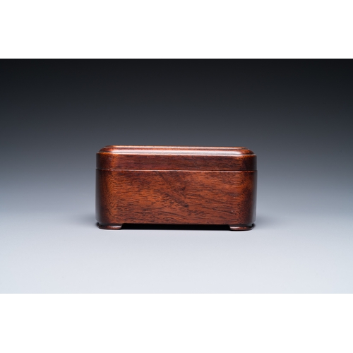 910 - A Chinese huali box and cover, a burl wood-topped stand, a table screen mirror and a pair of Buddhis... 