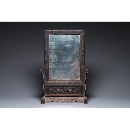 910 - A Chinese huali box and cover, a burl wood-topped stand, a table screen mirror and a pair of Buddhis... 