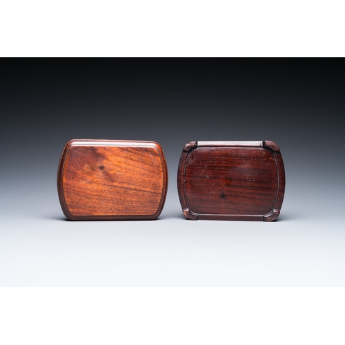 910 - A Chinese huali box and cover, a burl wood-topped stand, a table screen mirror and a pair of Buddhis... 