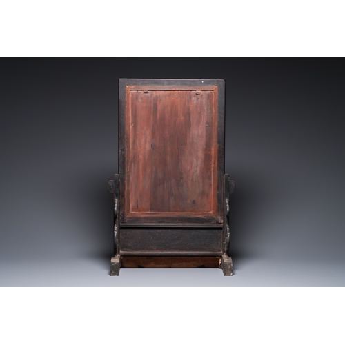 910 - A Chinese huali box and cover, a burl wood-topped stand, a table screen mirror and a pair of Buddhis... 