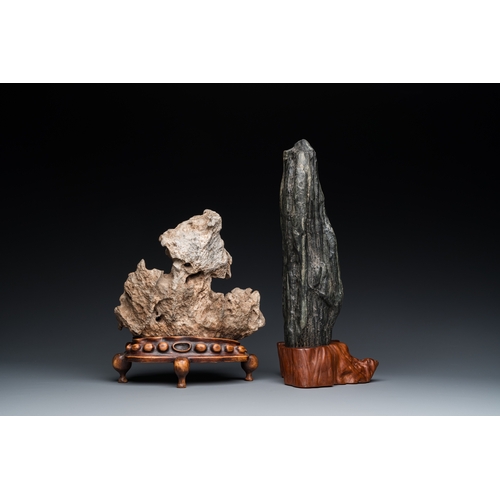 921 - Two Chinese 'gongshi or 'scholar's rocks' on wooden stands, Ming or laterH.: 34 cm (the tallest, inc... 