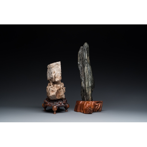 921 - Two Chinese 'gongshi or 'scholar's rocks' on wooden stands, Ming or laterH.: 34 cm (the tallest, inc... 