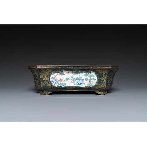 938 - A Chinese Canton enamel gilt-decorated dark-green-ground jardiniere with four inserted plaques, Qian... 