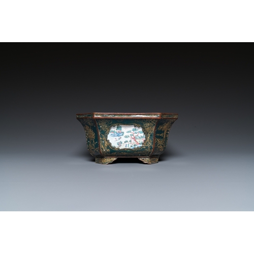 938 - A Chinese Canton enamel gilt-decorated dark-green-ground jardiniere with four inserted plaques, Qian... 