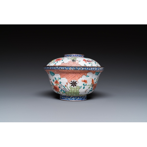 943 - A Chinese Canton enamel covered bowl with flowers and butterflies, Yongzheng/QianlongDia.: 12 cm - H... 