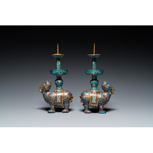 954 - A pair of Chinese cloisonne candlesticks in the shape of pixiu, QingH.: 31,5 cm