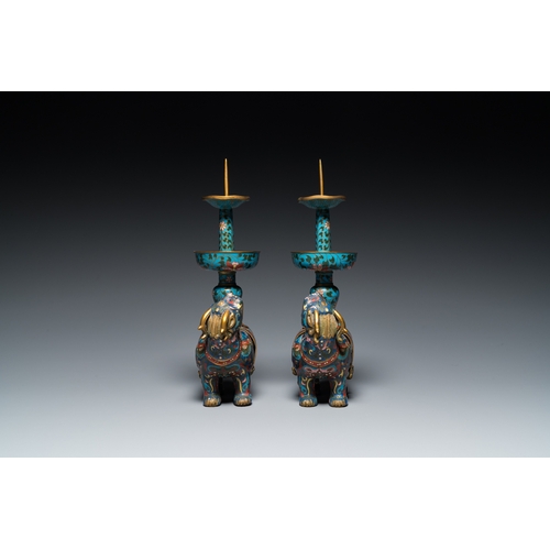 954 - A pair of Chinese cloisonne candlesticks in the shape of pixiu, QingH.: 31,5 cm