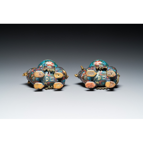 954 - A pair of Chinese cloisonne candlesticks in the shape of pixiu, QingH.: 31,5 cm