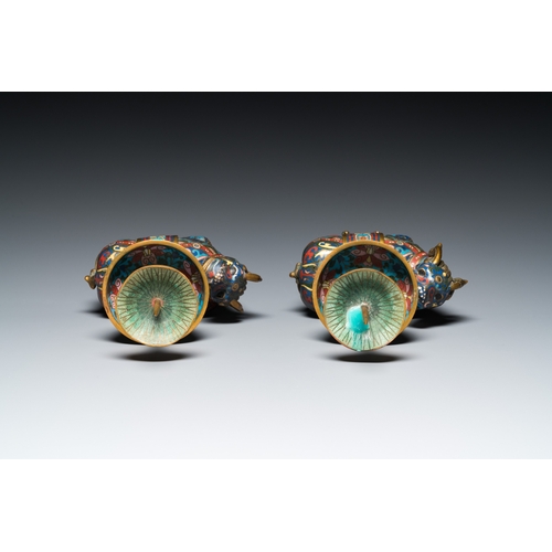 954 - A pair of Chinese cloisonne candlesticks in the shape of pixiu, QingH.: 31,5 cm