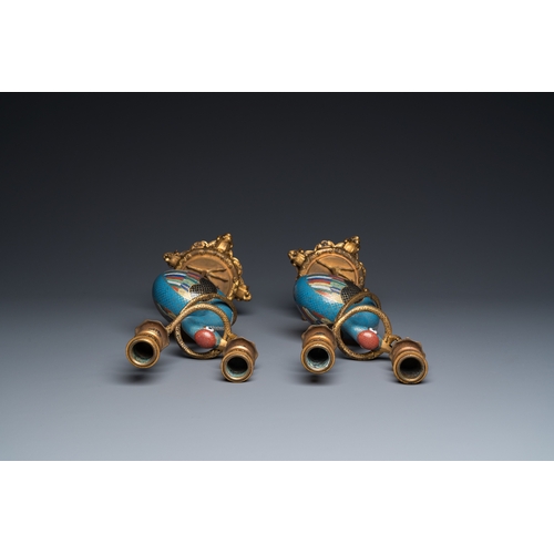 955 - A pair of Chinese cloisonne cranes with gilt bronze candelabra mounts, 18/19th C.H.: 39 cm... 