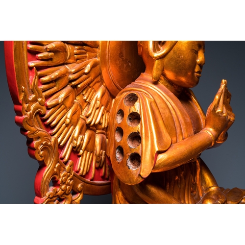 1002 - A large Vietnamese red-and-gilt-lacquered wood sculpture of Avalokitesvara with 18 arms, 19/20th C.H... 