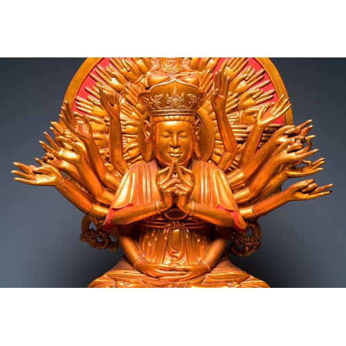 1002 - A large Vietnamese red-and-gilt-lacquered wood sculpture of Avalokitesvara with 18 arms, 19/20th C.H... 