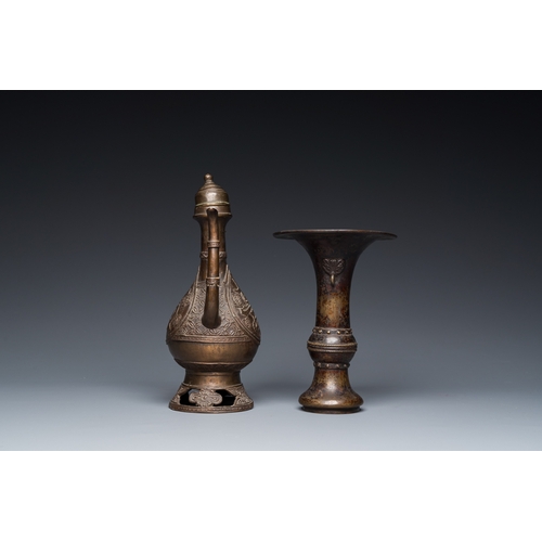 1098 - A Chinese bronze 'gu' vase and an Islamic market bronze ewer and cover, MingH.: 23,5 cm (the Islamic... 