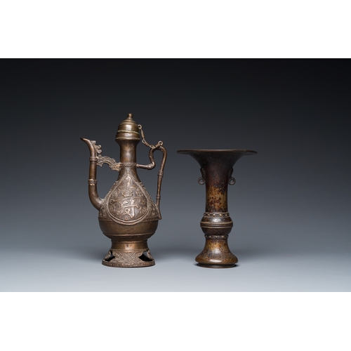 1098 - A Chinese bronze 'gu' vase and an Islamic market bronze ewer and cover, MingH.: 23,5 cm (the Islamic... 