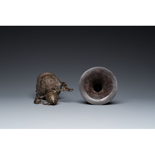 1098 - A Chinese bronze 'gu' vase and an Islamic market bronze ewer and cover, MingH.: 23,5 cm (the Islamic... 