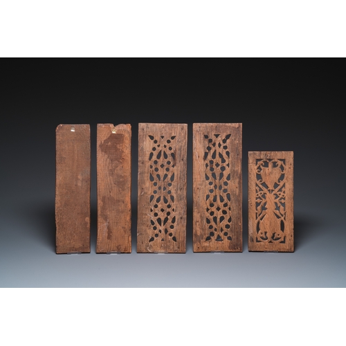 1205 - A collection of 11 carved wooden panels with various designs, France, Holland and/or Flanders, 14/16... 