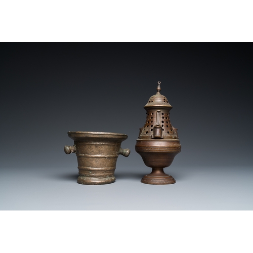 1207 - A bronze mortar, a censer and two pax of which one gilded, Western Europe, 16/17th C.H.: 21 cm (the ... 