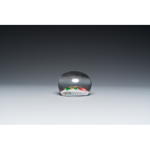 1214 - A glass Saint Louis paperweight with fuchsia on a latticinio-ground,  ca. 1850Dia.: 8,5 cm - H.: 5,5... 