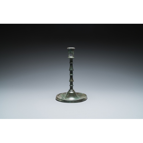 1239 - A Dutch or Flemish knotted bronze candlestick, 15th C.H.: 22,5 cm
 
 Provenance:- The collection of ... 