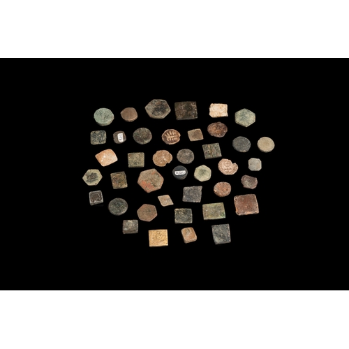 1243 - A collection of 40 copper and lead coin weights, 14/15th C.Dia.: 2,2 cm (the largest)