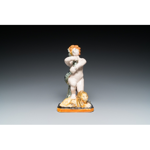 1277 - A polychrome Brussels faience sculpture of a putto with a snake standing on a lion, late 18th C.H.: ... 