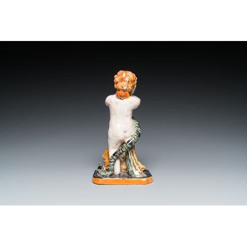 1277 - A polychrome Brussels faience sculpture of a putto with a snake standing on a lion, late 18th C.H.: ... 